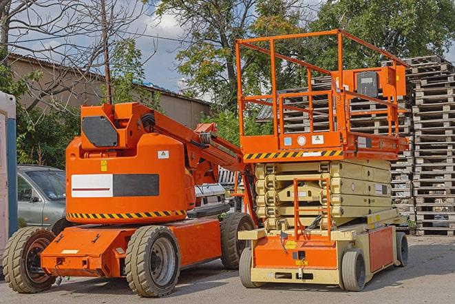 daytime activity in a bustling warehouse with forklift in East Meadow