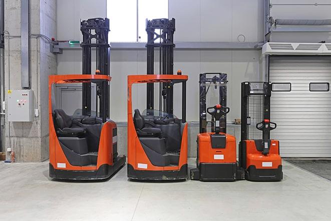 electric forklift positioned at a warehouse